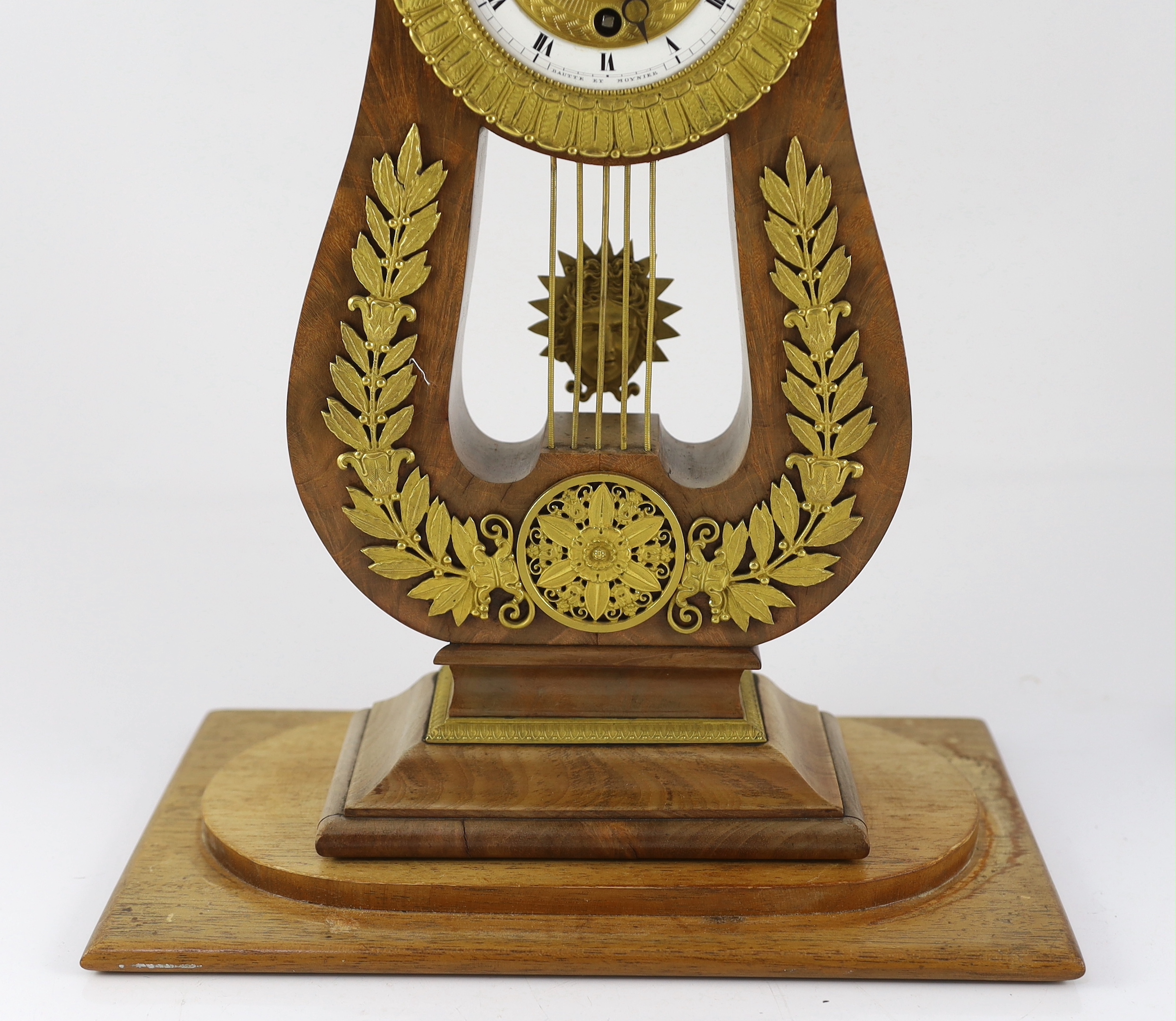 Bautte et Moynier. An early 19th century Swiss ormolu mounted mahogany lyre shaped mantel timepiece